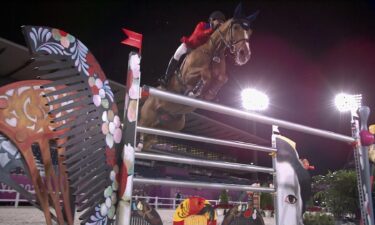 Low angle of McLain Ward and Contagious jumping multi-color hairbow oxer