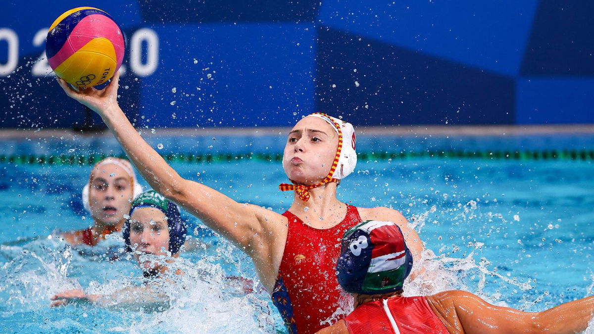 Spain's Elena Ruiz takes a shot in the women's water polo semifinal between Spain and Hungary.