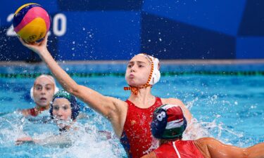 Spain's Elena Ruiz takes a shot in the women's water polo semifinal between Spain and Hungary.