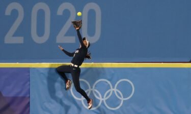Janie Reed soars to catch a would-be home run in the softball gold medal game at the Tokyo Olympics.