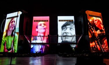 A video tribute to Charlie Watts plays before the Rolling Stones perform in St. Louis