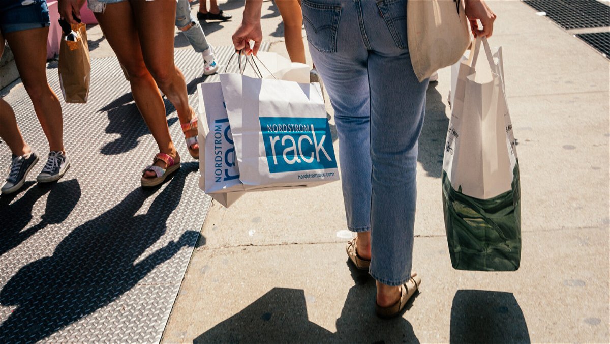 <i>Jutharat Pinyodoonyachet/Bloomberg/Getty Images</i><br/>US retail sales increased last month despite rising cases of the Covid-19 Delta variant. Pedestrians carry shopping bags in the SoHo neighborhood of New York
