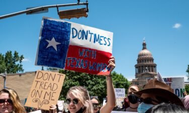 Texas 6-week abortion ban went into effect early Wednesday.  Abortion protesters here hold up signs as they march down Congress Ave outside the Texas state capitol on May 29