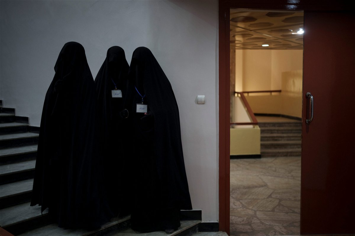 <i>Felipe Dana/AP</i><br/>Women will no longer be allowed to attend classes or work at Kabul University for now. Women in an auditorium at Kabul University are pictured here during a demonstration in support of the Taliban on September 11.
