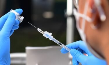 The Pfizer Covid-19 vaccine is prepared for administration at a vaccination clinic for homeless people