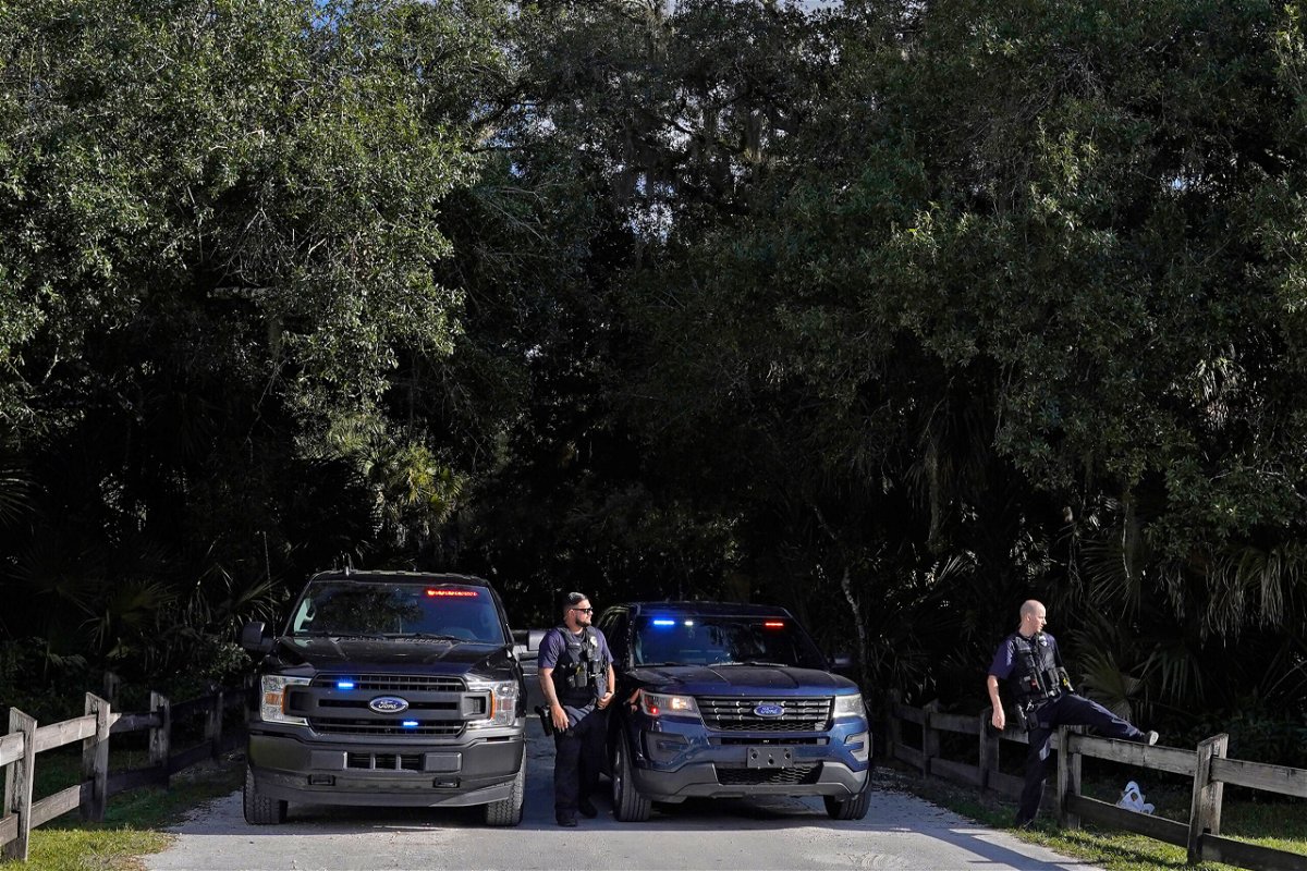 <i>Chris O'Meara/AP</i><br/>North Port police officers block the entrance to the Myakkahatchee Creek Environmental Park on Wednesday.
