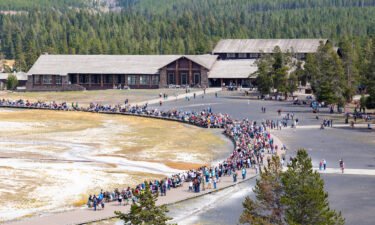 Crowds gather for an afternoon Old Faithful geyser eruption in September 2021.