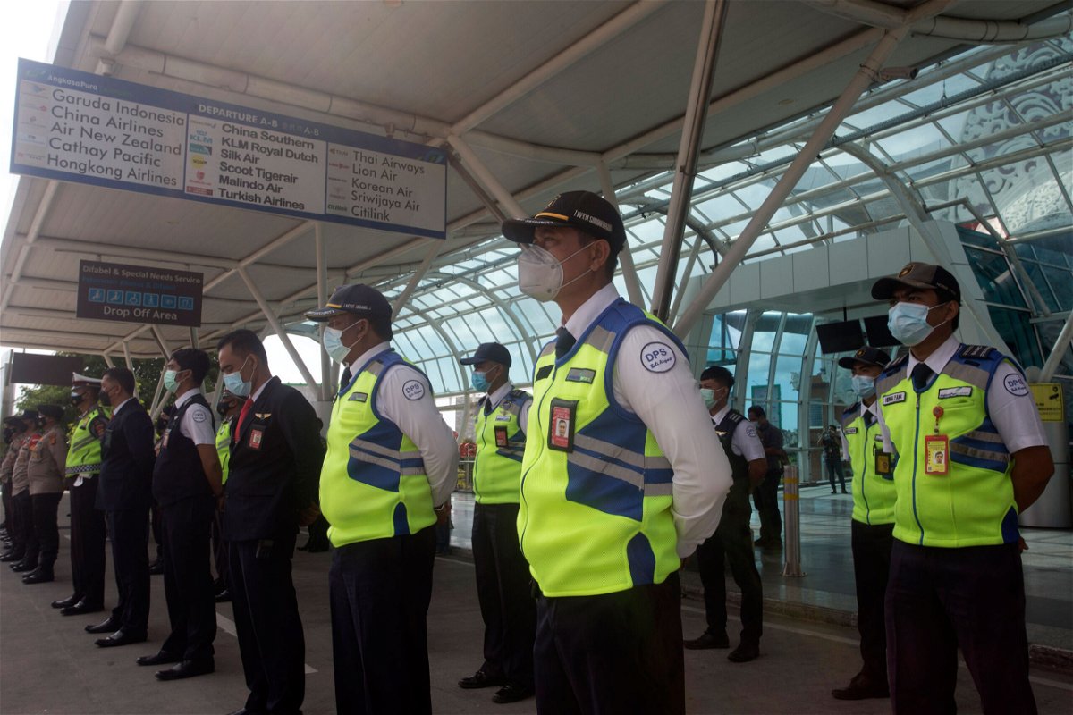 <i>Firdia Lisnawati/AP</i><br/>Indonesia's Bali and Riau Islands are reopening to visitors from 19 countries starting Thursday. Airport security personnel are shown here during a briefing in preparation of the reopening of International Ngurah Rai Airport in Bali
