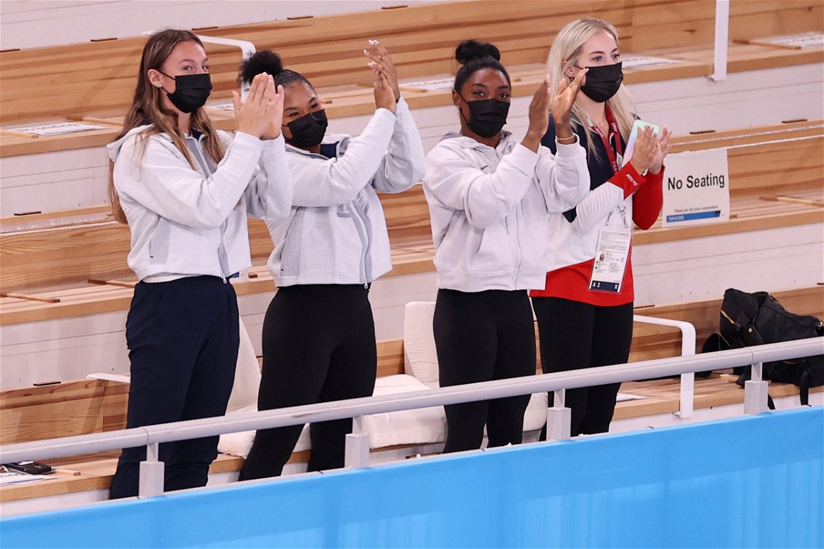 <i>Laurence Griffiths/Getty Images</i><br/>Simone Biles and her teammates cheer during the Tokyo Olympics on July 29 in Japan.