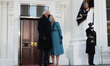US President Joe Biden and First Lady Dr. Jill Biden embrace at the White House after Biden's inauguration on January 20
