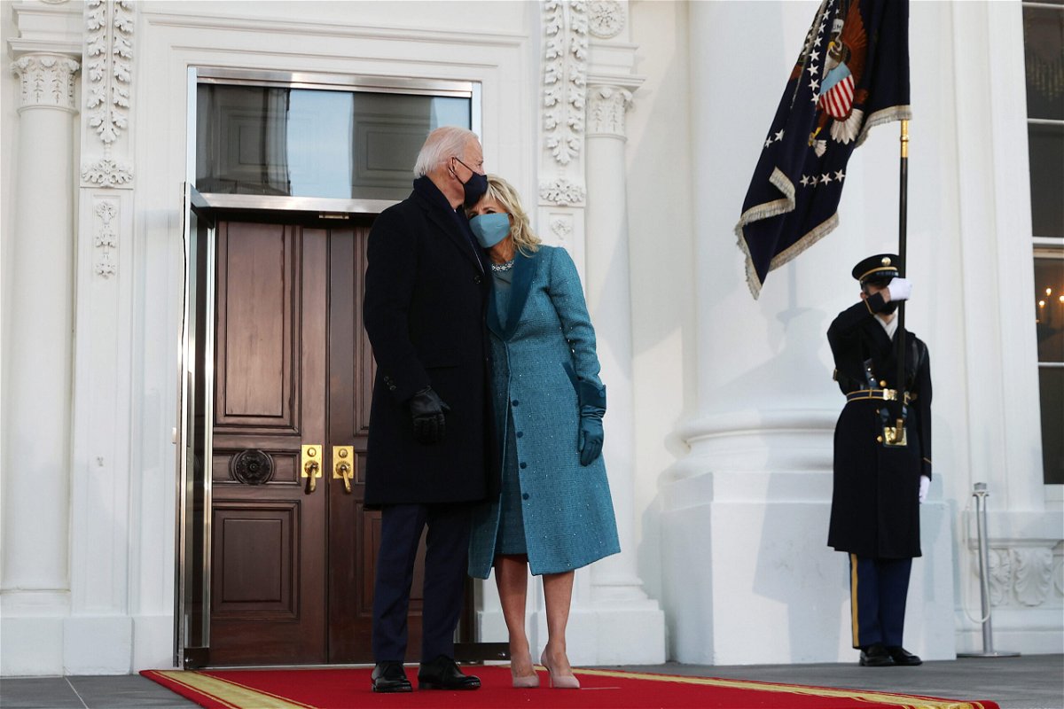 <i>Chip Somodevilla/Getty Images</i><br/>US President Joe Biden and First Lady Dr. Jill Biden embrace at the White House after Biden's inauguration on January 20