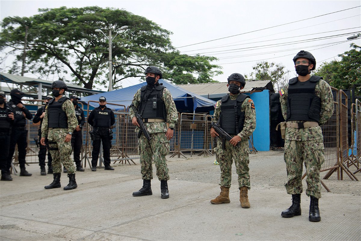<i>Fernando Mendez/AFP/Getty Images</i><br/>Military police stand guard outside the Guayas 1 prison after a violent outburst between the inmates that left 58 dead in Guayaquil