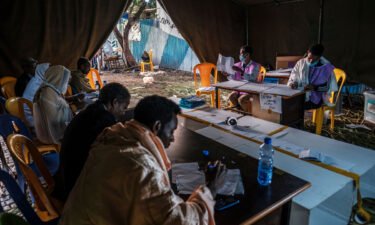 Electoral officials count ballots at a polling station in the city of Bahir Dar