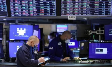 Traders work on the trading floor at the New York Stock Exchange (NYSE) in Manhattan