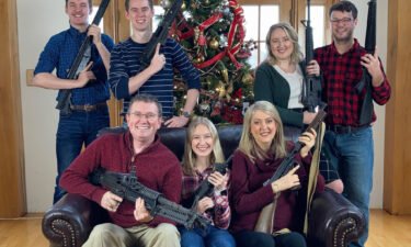 Rep. Thomas Massie tweeted a photo of him and his family holding guns in front of a Christmas tree