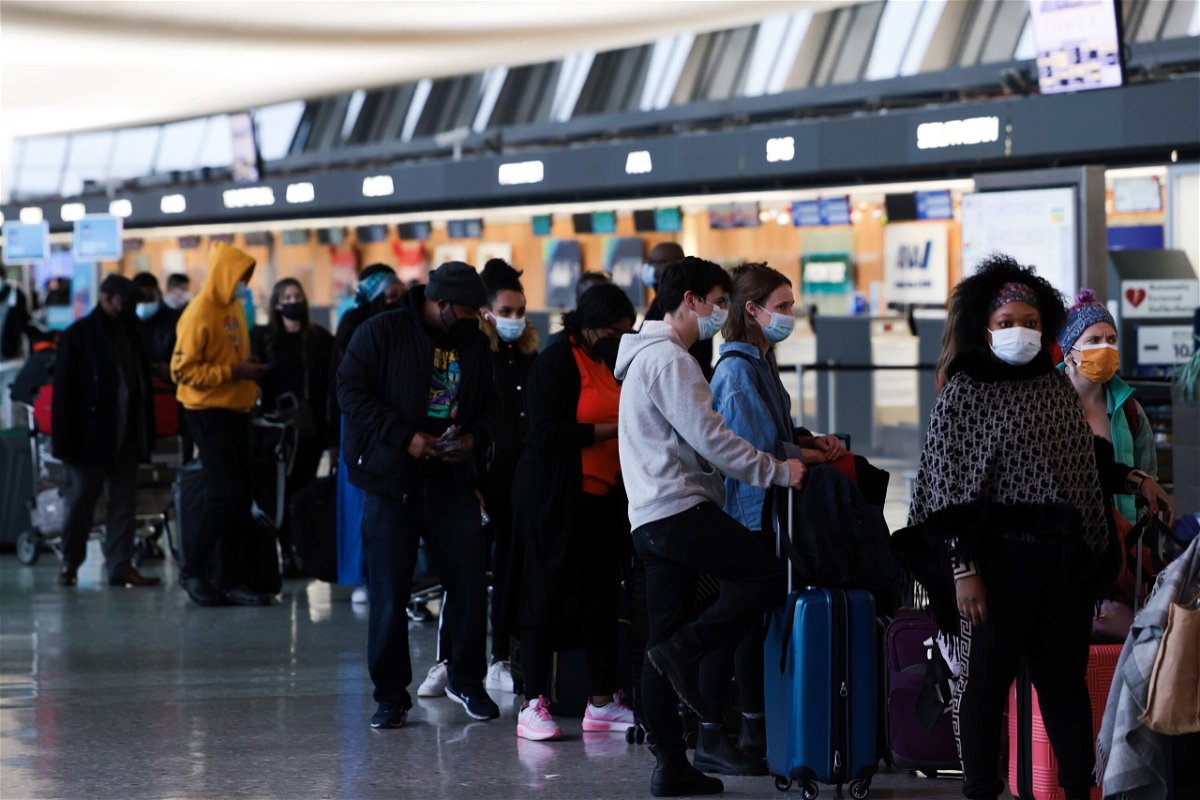 <i>Anna Moneymaker/Getty Images</i><br/>Passengers wait in line to check in for their flights at the Dulles International Airport in Dulles