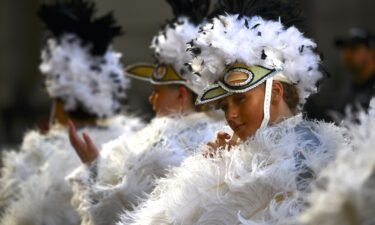 America's oldest folk parade returns after coronavirus shut down the New Year's Day tradition that has come under scrutiny for racist and other offensive costumes worn by some participants throughout the years