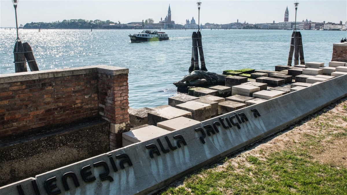 <i>Giacomo Cosua/NurPhoto via Getty Images</i><br/>A female tourist was thrown out of Venice after she was caught posing for photos topless on a war memorial.