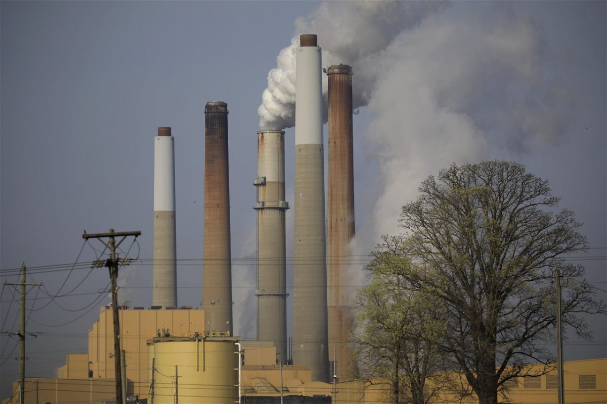 <i>Luke Sharrett/Bloomberg/Getty Images</i><br/>Smoke and steam rises from a coal-fired power plant in Kentucky in 2021. Greenhouse gas emissions from coal increased in 2021 for the first time in seven years