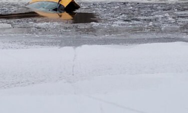The car sank in the river after a woman drove across the frozen water.