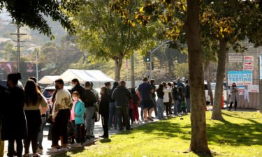 Students and staff wait in line for a Covid-19 test at a school in Los Angeles. As Los Angeles students and staff prepare to return to school January 11