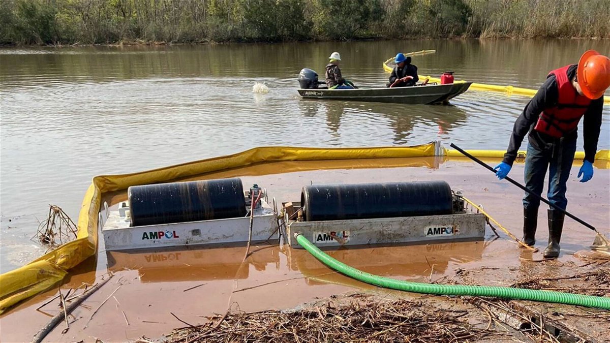 <i>Louisiana Department of Environmental Quality via AP</i><br/>Cleanup work is seen at the site where more than 300