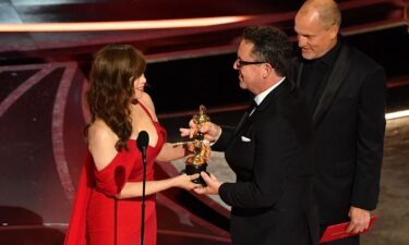 Rosie Perez presents Greig Fraser with the best cinematography Oscar for "Dune." The sci-fi movie dominated many of the technical categories on Sunday night