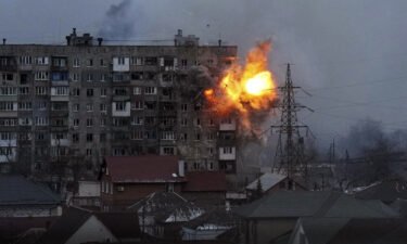 Russian forces fire at an apartment building in Mariupol