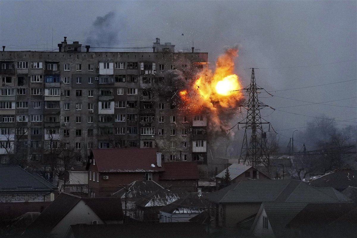 <i>Evgeniy Maloletka/AP</i><br/>Russian forces fire at an apartment building in Mariupol