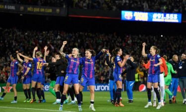 Barcelona's players celebrate at the end of the women's UEFA Champions League quarterfinal in Barcelona on March 30.  Wednesday's match saw the largest crowd to ever watch a women's football game.
