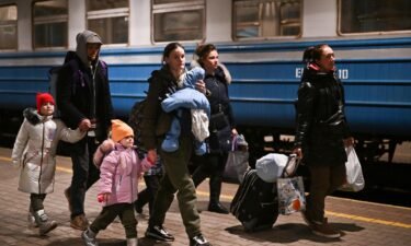 People arrive at Przemysl train station in Poland from Ukraine on March 20. At least 10 million people have been forced to flee their homes in Ukraine following Russia's invasion less than a month ago