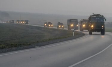 A convoy of Russian military vehicles is seen moving towards the border in the Donbas region of eastern Ukraine on February 23
