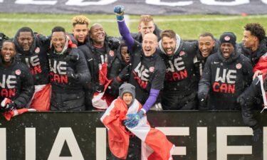 Canadian players celebrate securing a spot at the 2022 World Cup in Qatar after a 36-year absence from the men's World Cup.