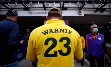 A man wearing a "Warnie" jersey attends the state memorial service for former Australian cricketer Shane Warne in Melbourne