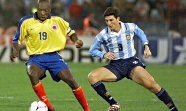 Colombia's Freddy Rincon takes the ball from Argentina's Javier Zanetti during a friendly match on 13 October