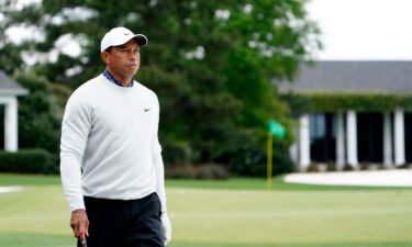 Tiger Woods walks the practice facility during the third round of The Masters golf tournament at Augusta National Golf Club.