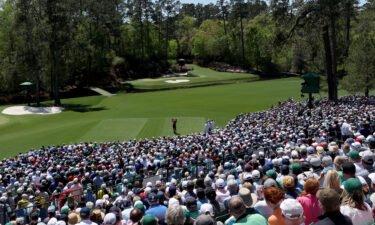 Tiger Woods plays his shot from the 12th tee during the final round of the Masters.