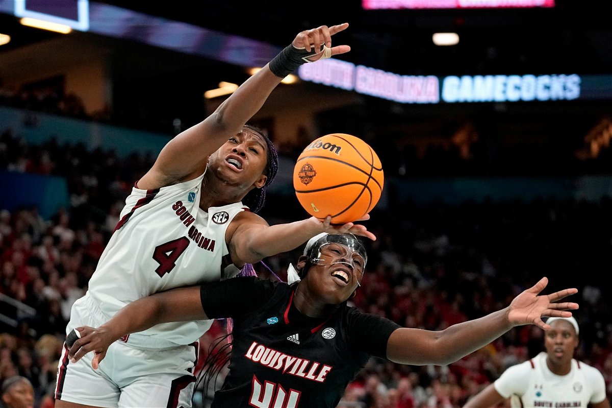 <i>Eric Gay/AP</i><br/>South Carolina's Aliyah Boston and Louisville's Olivia Cochran go after a loose ball during the first half of their game Friday night.