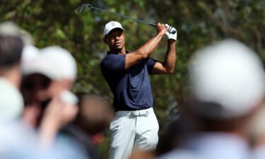 Woods takes a practice swing on the fourth tee during a practice round prior to the Masters.