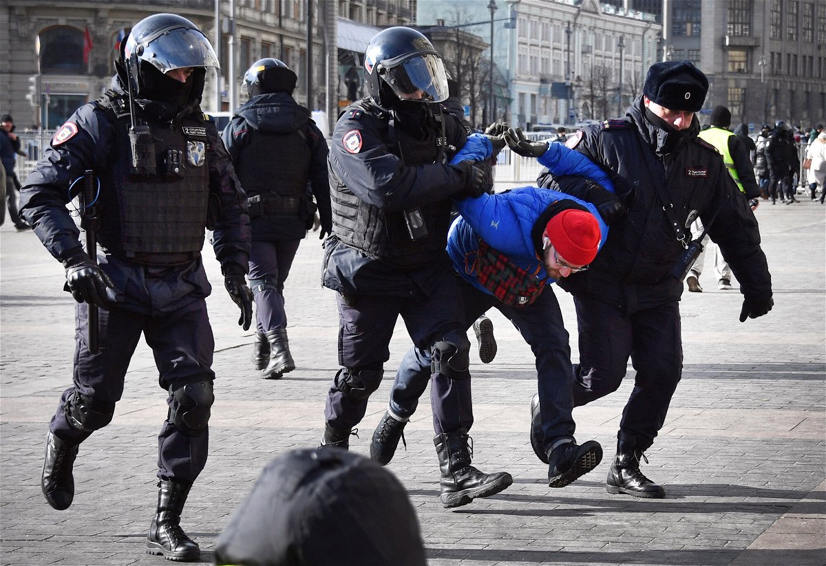 <i>AFP/Getty Images</i><br/>Police officers detain a man during a protest against Russia's invasion of Ukraine in Moscow on March 13.