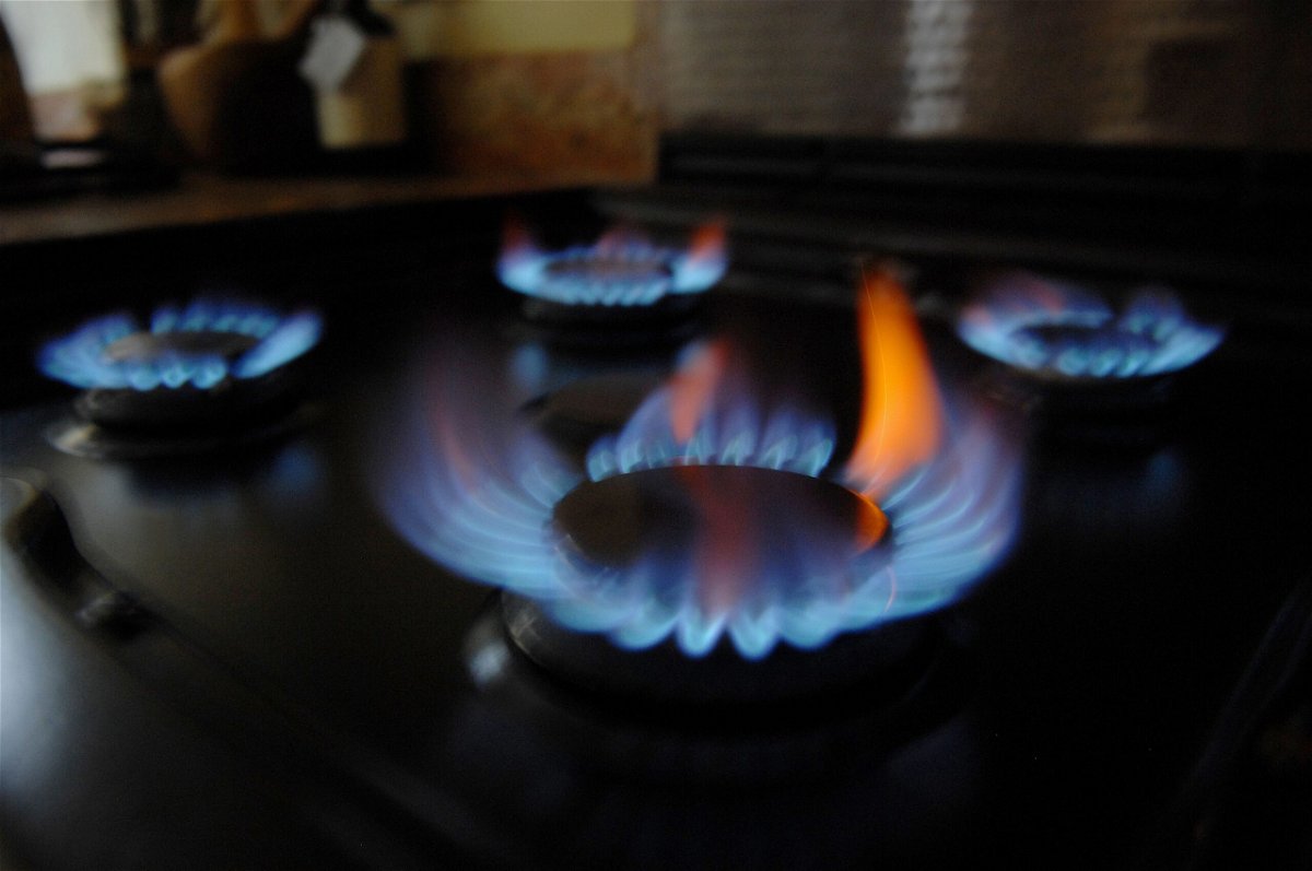 <i>Gill Allen/Shutterstock</i><br/>Britons are paying 54% more for their energy starting now. Gas burns on a gas home cooker in a kitchen in London
