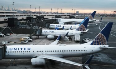 A few US airlines announced Monday that masks are now optional on their aircraft. United Airlines planes sit on the runway at Newark Liberty International Airport on November 30