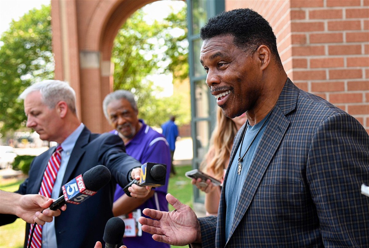 <i>Jason Vorhees/AP</i><br/>US Senate candidate Herschel Walker speaks with the media after a campaign rally at the Georgia Sports Hall of Fame in Macon