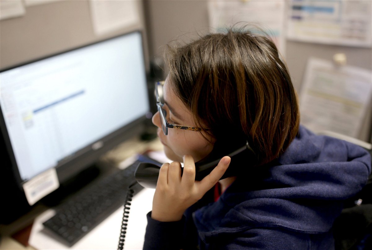 <i>Jonathan Wiggs/The Boston Globe/Getty Images</i><br/>A volunteer at the Samaritans Call Center takes a call at the office in Boston on February 28