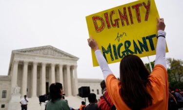 Immigration activists rally outside the US Supreme Court in Washington