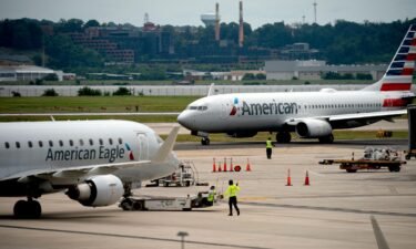 An American Eagle and American Airlines plane sits on the tarmac at Ronald Reagan Washington National Airport in Arlington