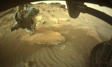 NASA's Perseverance rover captured an unusual image of something lying in the red sand of Mars: a bundle of string. The rover's front right hazard avoidance camera captured a wider image of the string (bottom).