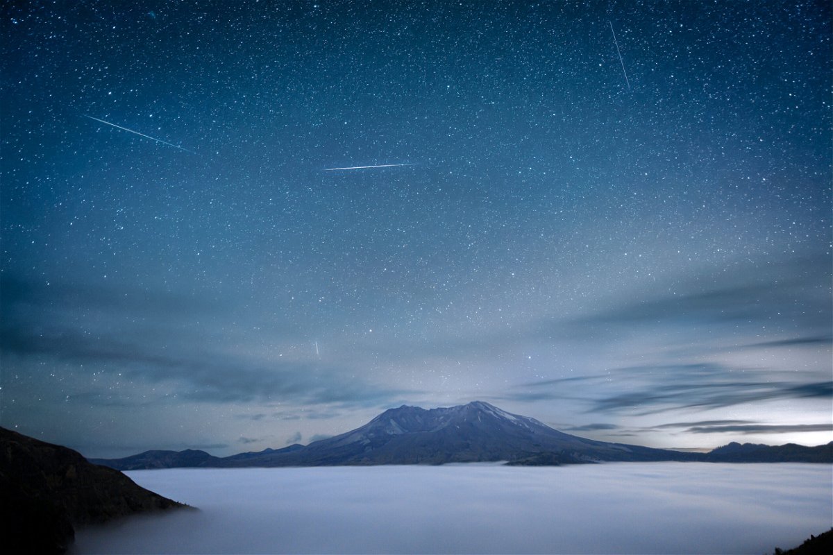 <i>Diana Robinson Photography/Moment RF/Getty Images</i><br/>Pictured is a past Delta Aquariids meteor shower occurring around 2 a.m. over Mount St. Helens in Washington State.