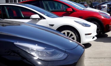 Tesla cars sit in a dealership lot on March 28