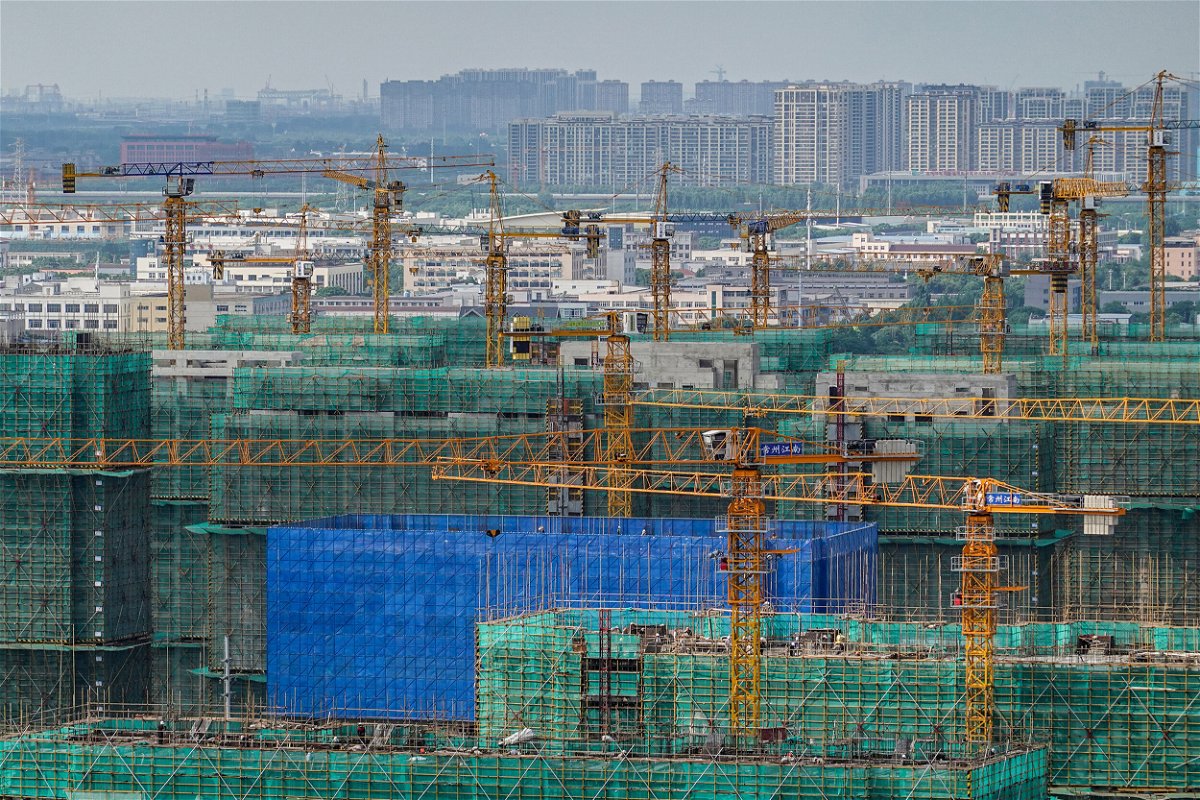 <i>Sheldon Cooper/SOPA Images/LightRocket/Getty Images</i><br/>Yellow pylons work at a construction site in Jiangsu